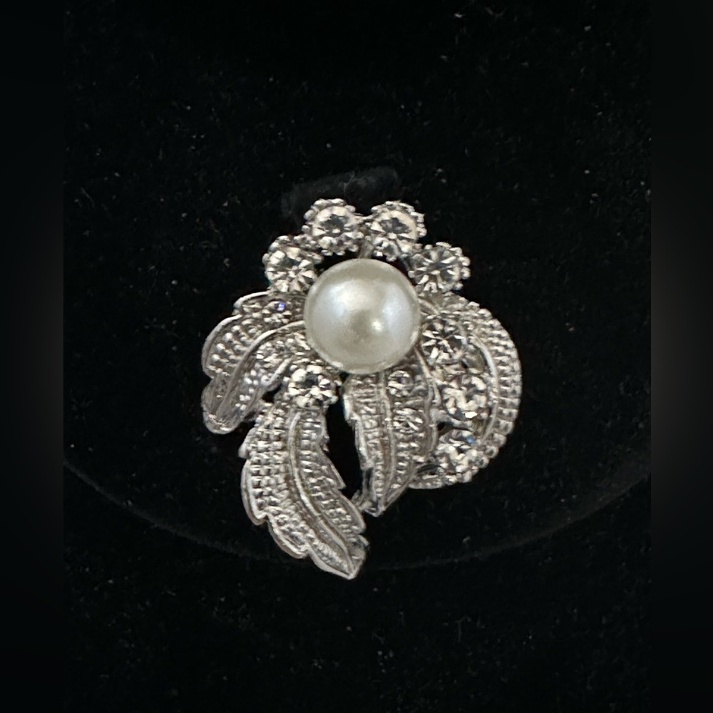 Silver tone brooch with rhinestones and faux pearls floral shape
